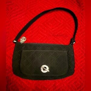 Vera Bradley small black quilted bag with silver latch on front pocket.